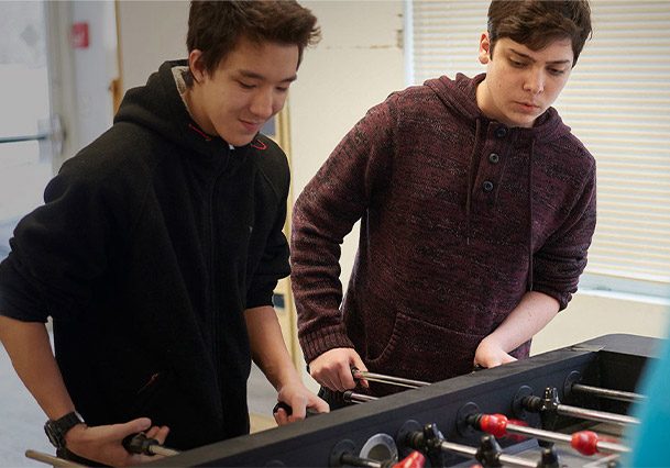 Woodhouse Academy Student Community Life Playing Foosball